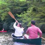 Susan and Randy paddle out