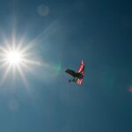 Flying the flag, literally. A parachutist floats to earth with the American Flag at Petit Le Mans