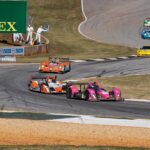 Nice field of cars cascades through turn 4 and the Esses